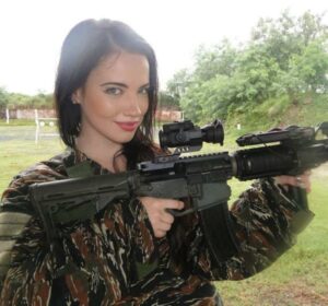 Sexy girls posing with guns